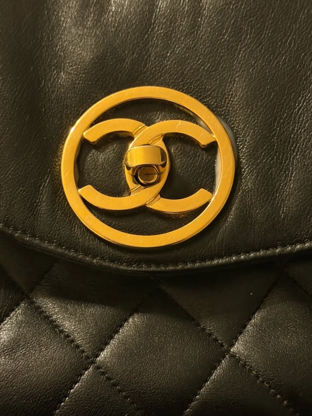 Vintage 24K CHANEL Black Quilted Leather Backpack with Gold CC Medallion